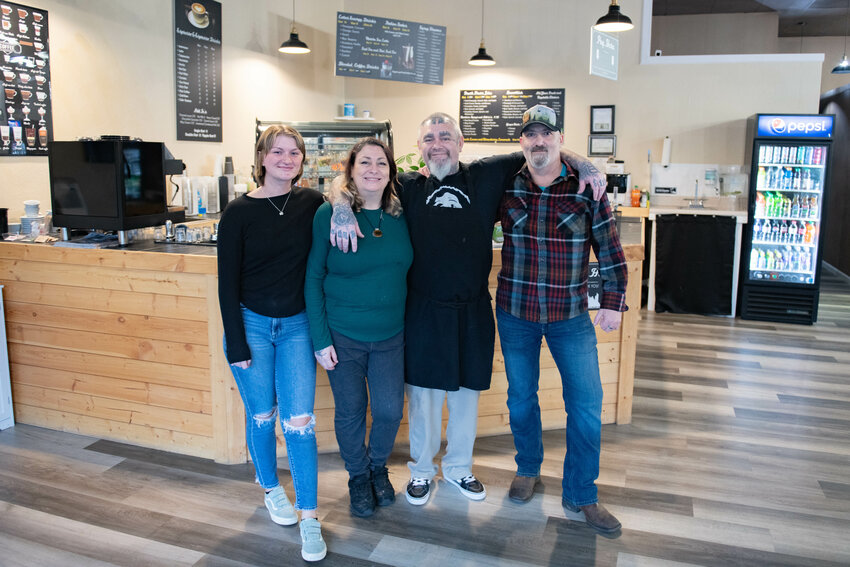 Owners Adrian and &quot;Pigpen&quot; Spear pose with their staff on Jan. 9 at their Rainy City Bagel Shop in Centralia.