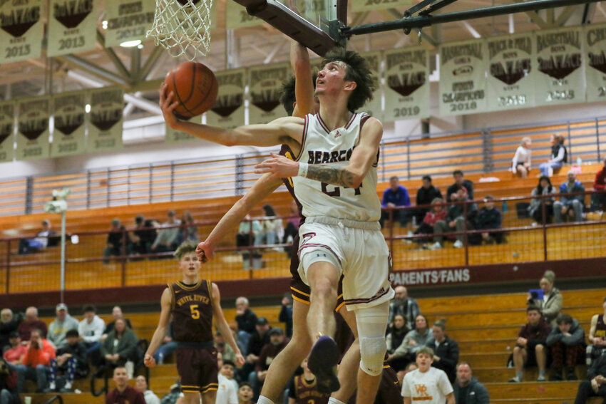 Tyler Klatush is forced under the basket on a layup during W..F. West's 59-36 loss to White River on Jan. 13.