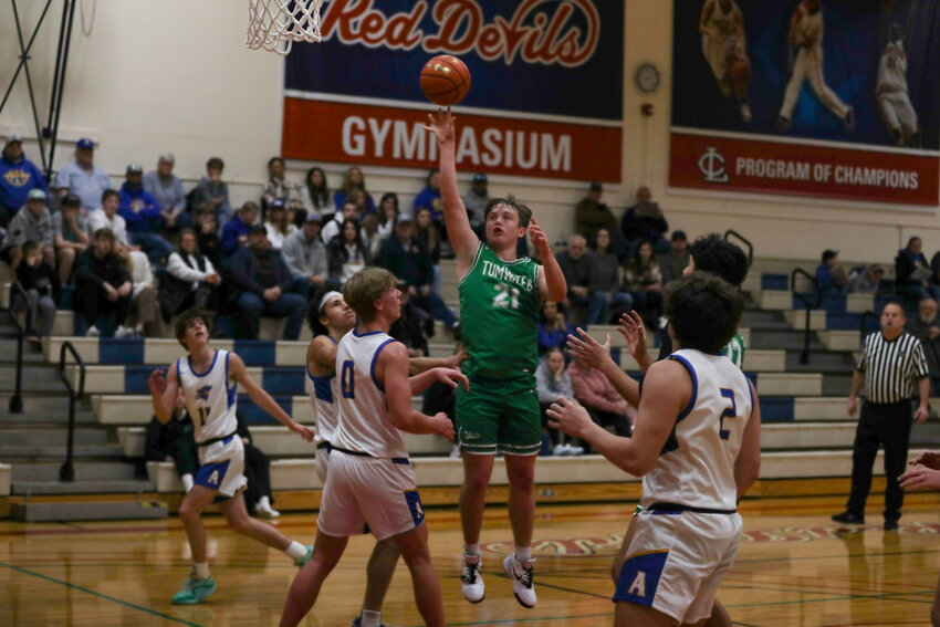 Jake Dillon goes up with one hand in the paint during Tumwater's game against Adna at Lower Columbia College on Jan. 15.