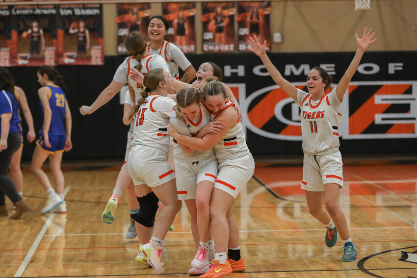 Centralia players celebrate after the final buzzer sounds on their 58-55 win over Rochester on Jan. 19.