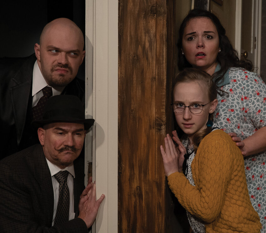 As the climax builds, con men Roat, played by Henry Lorch, and Carlino, played by Tony Provenzola, quietly wait on Susan, played by Kristen Bennett, and Gloria, played by Amelia Benson, in &ldquo;Wait Until Dark,&rdquo; being performed by Love Street Playhouse.