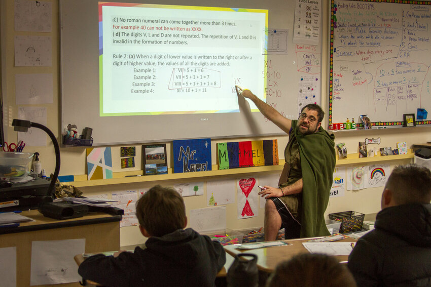 North Fork Elementary teacher Matthew Kamel taught students how to perform mathematics using Roman numerals in the style of the Middle Ages.
