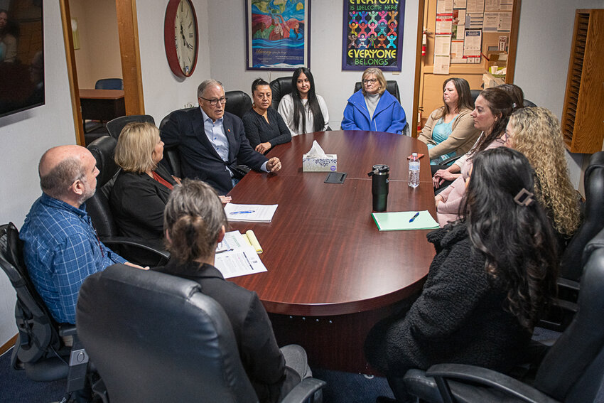 Gov. Jay Inslee talks with Hope Alliance staff during a roundtable discussion at the organization's Centralia office on Friday, Jan. 19.