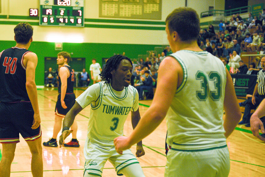 Sahara Anthony III high-fives Beckett Wall after Wall drew a foul and hit a layup during Tumwater's win over Shelton on Jan. 22.