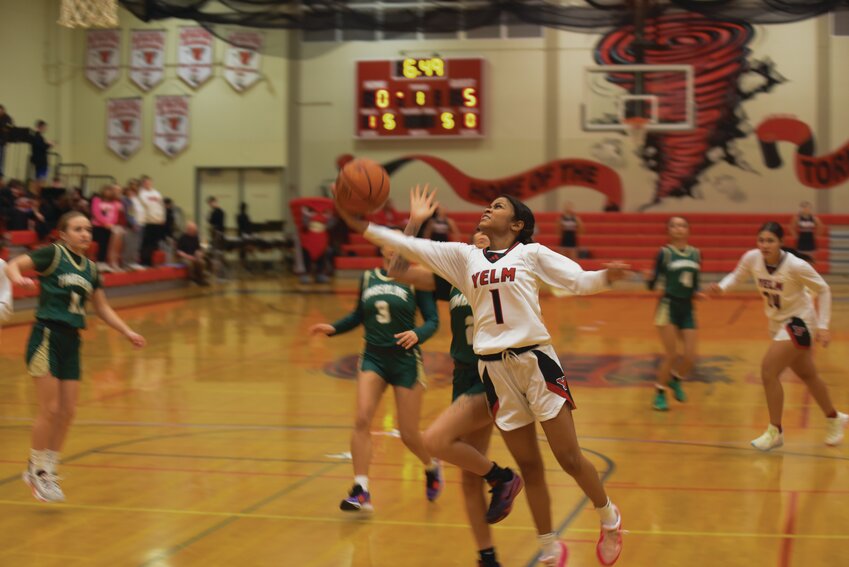 Senior guard Lilli Williams drives to the basket and attempts a layup on Wednesday, Jan. 17.