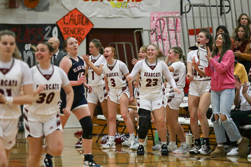 The W.F. West bench celebrates a late basket during W.F. West's win over Black Hills on Jan. 23.