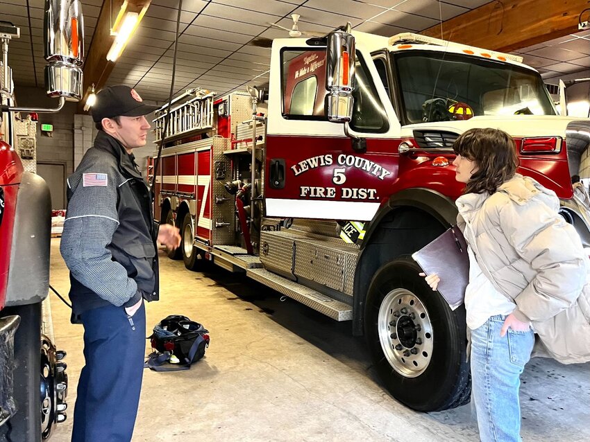 U.S. Rep. Marie Gluesenkamp Perez speaks with staff at Lewis County Fire District 5 in Napavine on Tuesday, Jan. 23.