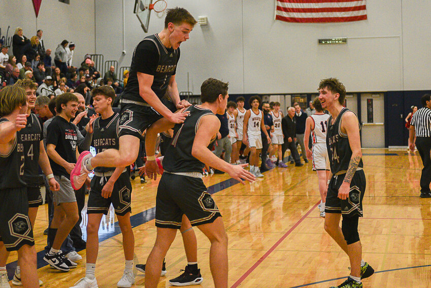 Parker Eiswald jumps on Grady Westlund in celebration after the final buzzer of W.F. West's 62-48 win at Black Hills on Jan. 24.