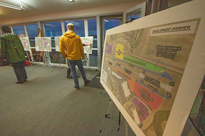 Proposed upgrades are seen on posters on Tuesday, Jan. 23, inside the Scott Crossfield Terminal at the Chehalis-Centralia Airport during the second of three open houses held during the airport's master plan update process.
