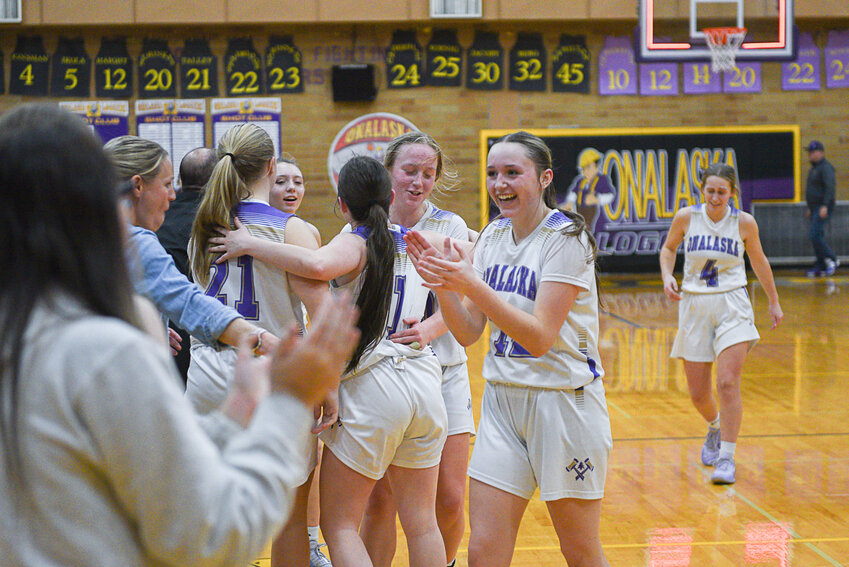 Onalaska players celebrate at the final buzzer on their 44-43 win over MWP on Jan. 25.
