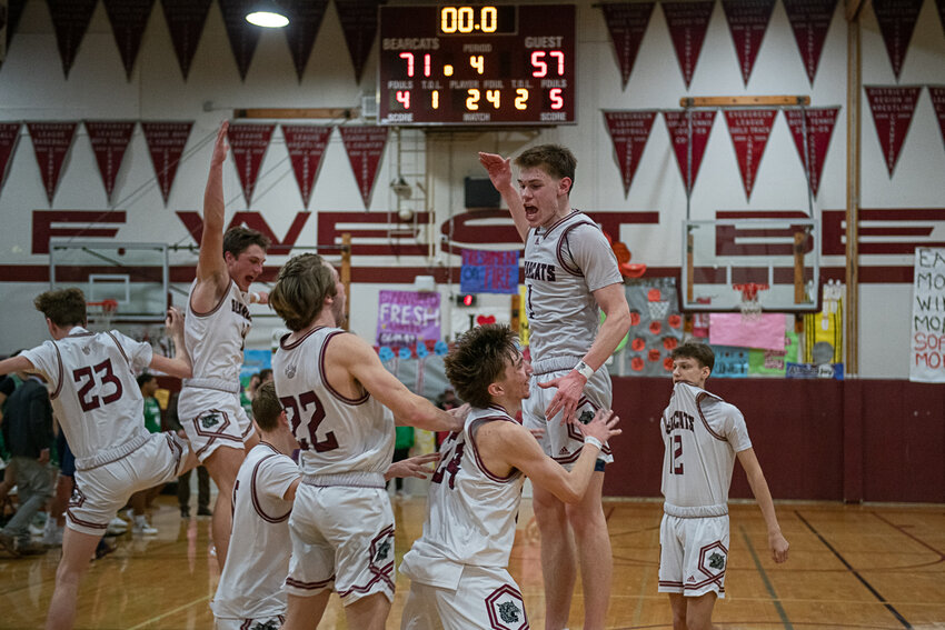 Bearcat players celebrate as the final buzzer sounds after a 71-57 W. F. West win over Tumwater on Jan. 26.