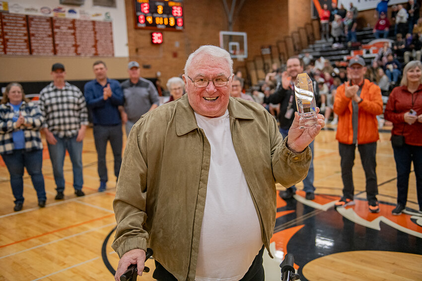 Gary Loomis is honored at halftime of the boys basketball swamp cup game and presented with the inaugural Prestigious Centralia Alumni award on Jan. 30.