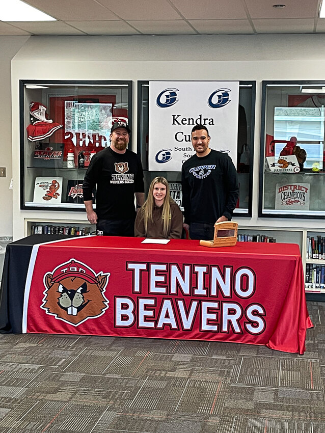 Kendra Cutlip poses with Tenino soccer coach Dave Montgomery and SPSCC assistant coach Lee Baker after signing her NLI on Jan. 30.