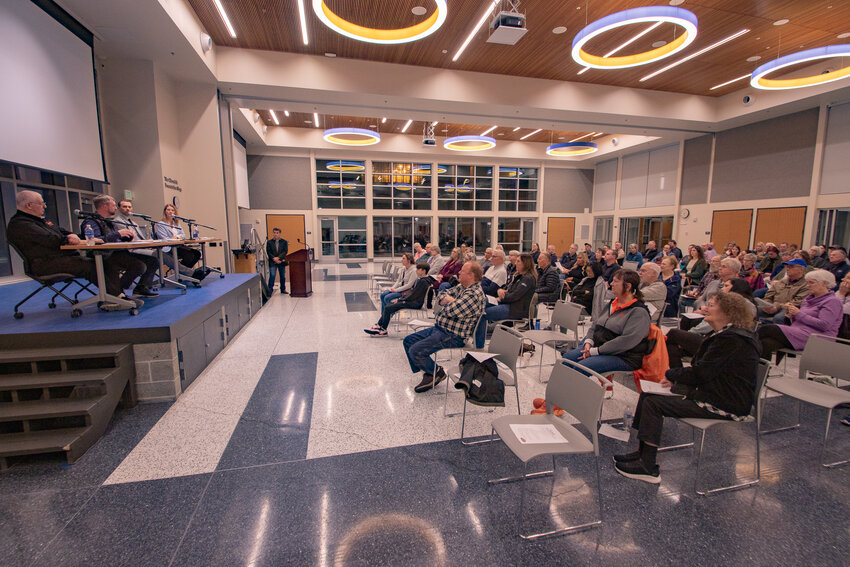 Centralia residents look on while Port of Centralia Commissioner Kyle Markstrom talks local infrastructure during a community town hall in Centralia College's TransAlta Commons on Wednesday, Jan. 31.
