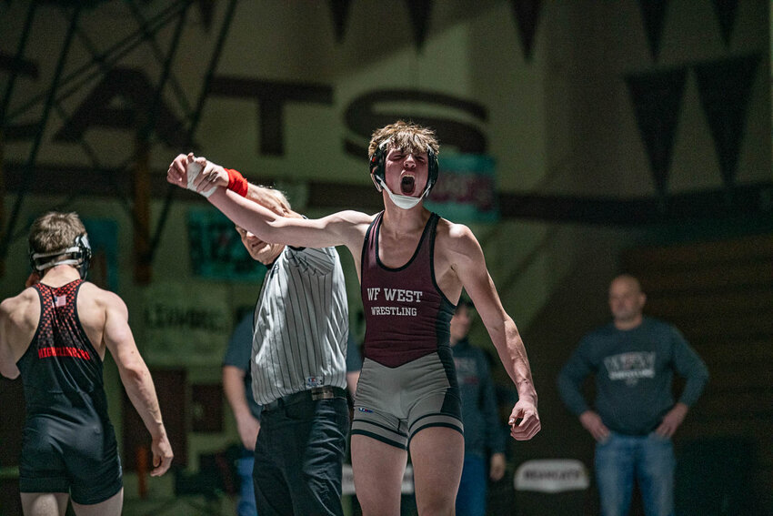 Graysen Serl celebrates after scoring a takedown in the final seconds to win his finals match at the 2A EVCO Sub-Regional Tournament at W.F. West High School on Feb. 3.