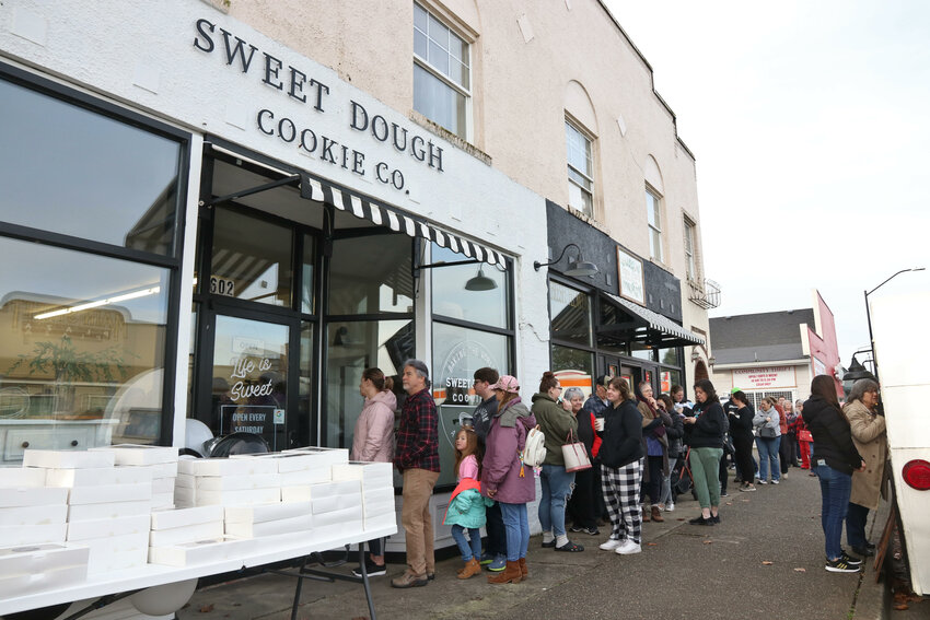 A long line forms outside Sweet Dough Cookie Co. in Centralia on Saturday, Feb. 3. The Pour House was on hand to make drinks for people in line.
