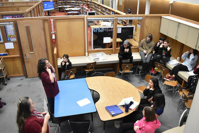 With the help of Hoquiam Native Education Coordinator Sandy Ruiz, bottom-left, Cosette Terry-itewaste leads a Quinault language class at Hoquiam Middle School on Friday, Feb. 2.