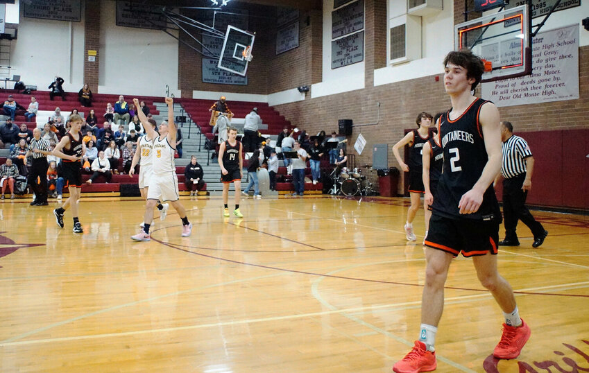 A dejected Jacob Meldrum walks off the court in Montesano after Rainier lost to Forks in overtime in the opening round of the District 4 2B tournament at Montesano High School on Feb. 3.