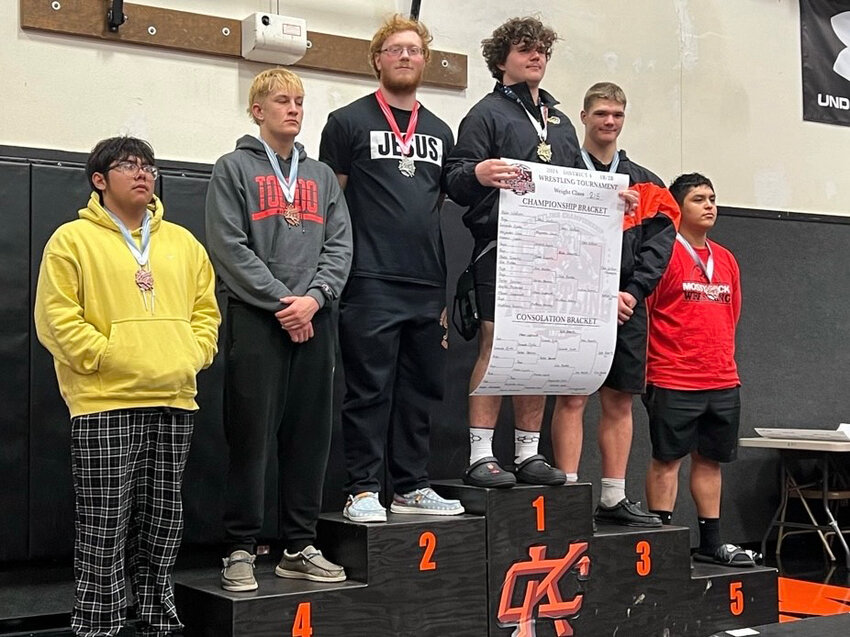 Matthew Kenney takes the second-place podium while Blake Roberts takes third in the 215 division at the sub-regional tournament on Feb. 3.