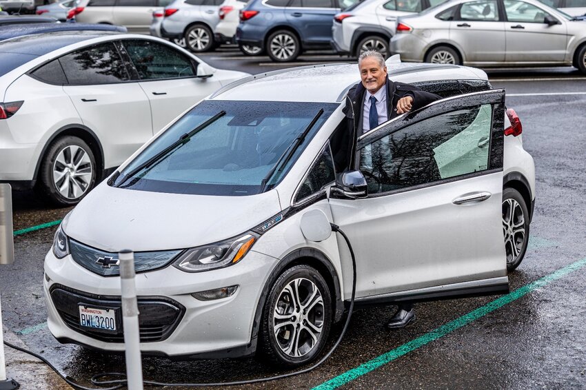 State Sen. Jeff Wilson, R-Longview, stands by his Chevrolet Bolt in this photo provided by his office.