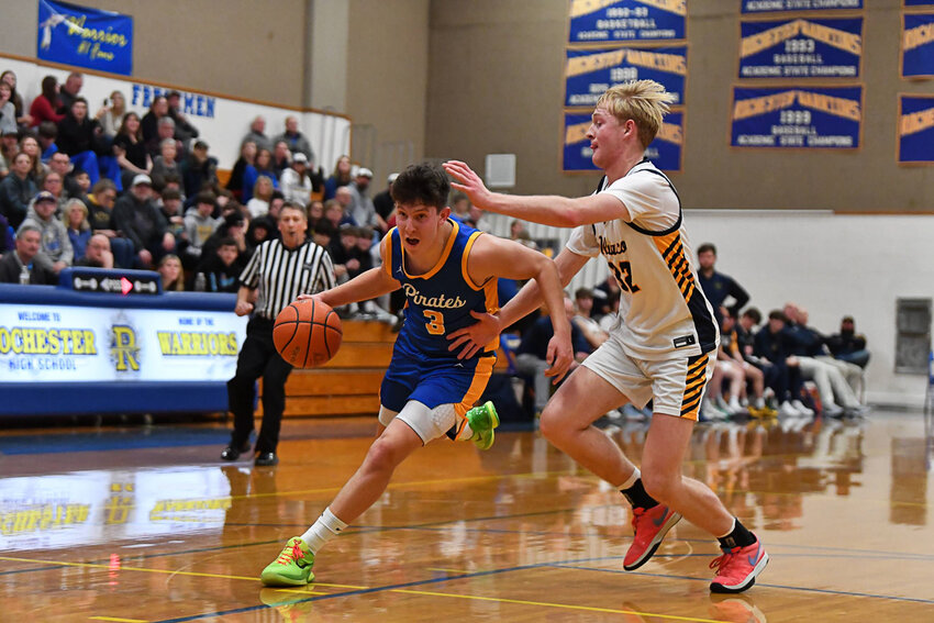 Braeden Salme races by a defender during Adna's 70-48 win over Ilwaco in a 2B District 4 quarterfinal at Rochester on Feb. 7.