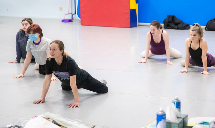 Briana Jones stretches with students while preparing for upcoming performances during a class at the Southwest Washington Dance Center in 2023.