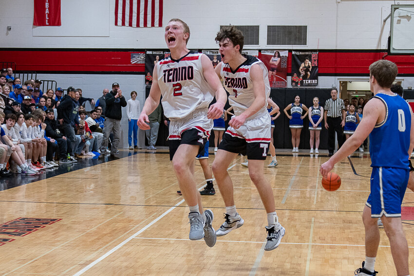Austin Gonia and Jack Burkhardt celebrate a win after Tenino's 63-52 win over Elma on Feb. 9.