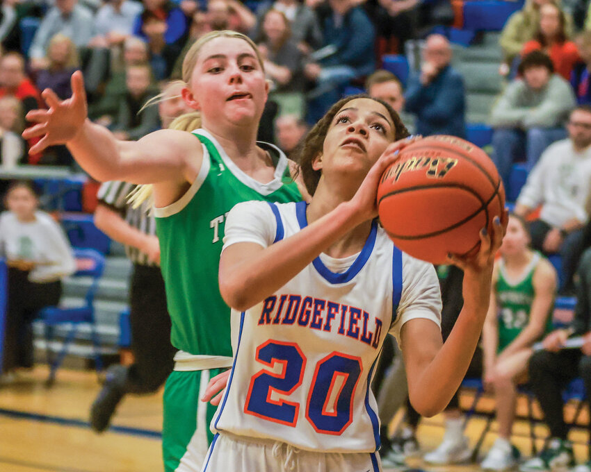 Ridgefield&rsquo;s Jalise Chatman attempts a layup prior to being fouled in the Spudders&rsquo; 55-28 win over Tumwater in the district playoffs on Friday, Feb. 9.