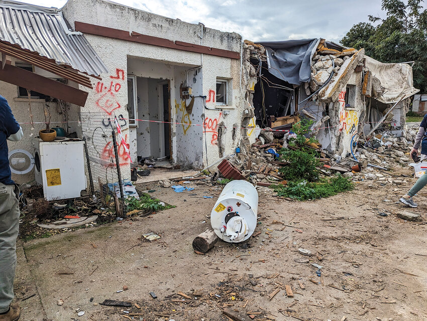 A building at the Kfar Aza kibbutz in Israel near the Gaza Strip was heavily damaged by Hamas. The red markings on the building are from search and rescue to label if any bodies were inside.