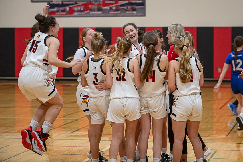 The Mossyrock girls basketball team celebrates a state tournament berth after their 35-28 district tournament win over Willapa Valley on Feb. 12.