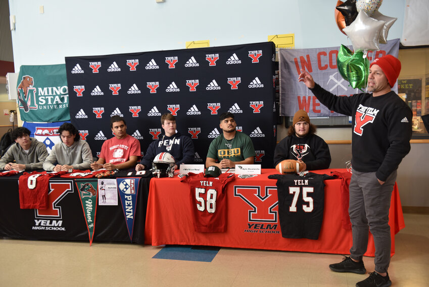Head coach Jason Ronquillo speaks about his six college bound Tornado athletes at Yelm's signing day event on Wednesday, Feb. 7.