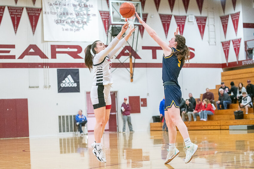 Stefani Arceo-Hansen shoots a three during Toledo's loss to Forks on Feb. 17. in Chehalis.