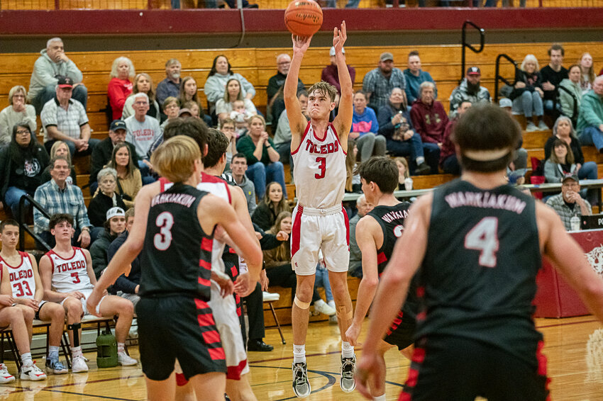 Rogan Stanley takes a shot during Toledo's loss to Wahkiakum on Feb. 17. in Chehalis.