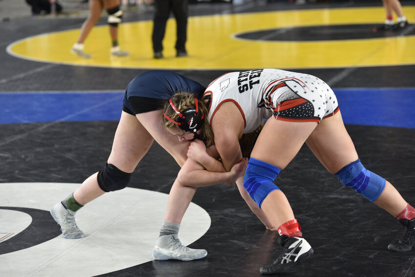 Yelm's Emma Norman, 100 pounds, wrestles Decatur's Jaelyn Quintanilla on Friday, Feb. 16, at Mat Classic XXXV.