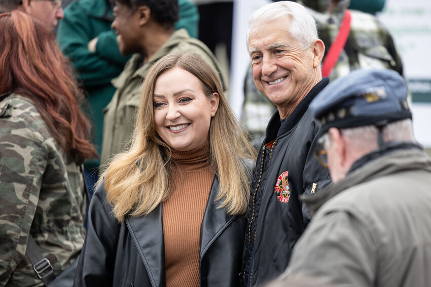 Republican Governor candidate Dave Reichert poses for a photo with Brandi Kruse, podcaster, during the &ldquo;Let&rsquo;s Go Washington&rdquo; initiatives rally at the Capitol in Olympia on Friday, Feb. 23, 2024.
