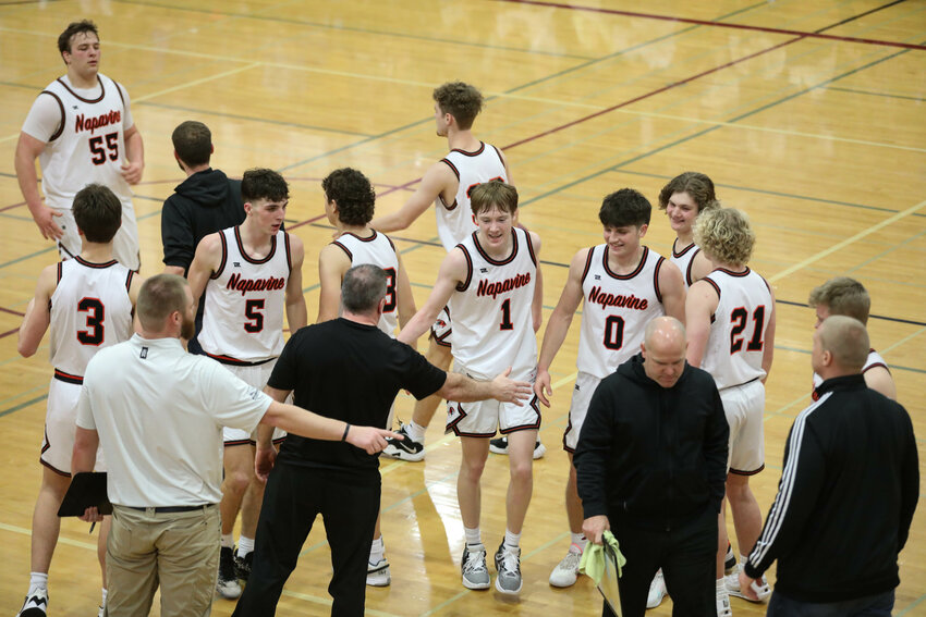 The Tigers celebrate after a bucket forced a St. George's timeout during Napavine's 70-47 win over St. George's in the Regional Round of the 2B State Tournament on Feb. 24 at W.F. West.