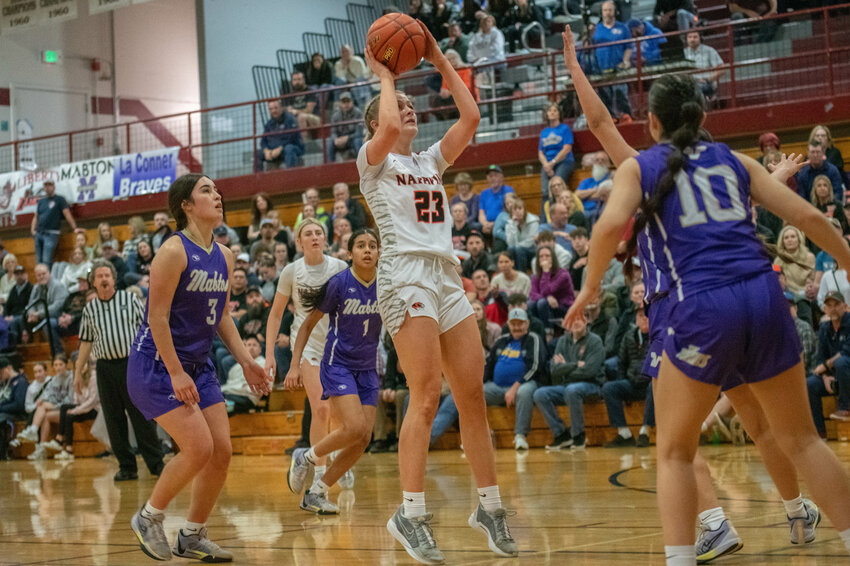 Napavine's Kiera O'Neill takes a jump shot around several Mabton defenders during Saturday's Class 2B opening round contest at W.F. West High School. O'Neill led the Tigers with 15 points and 15 rebounds in their 48-38 loss to the Vikings.