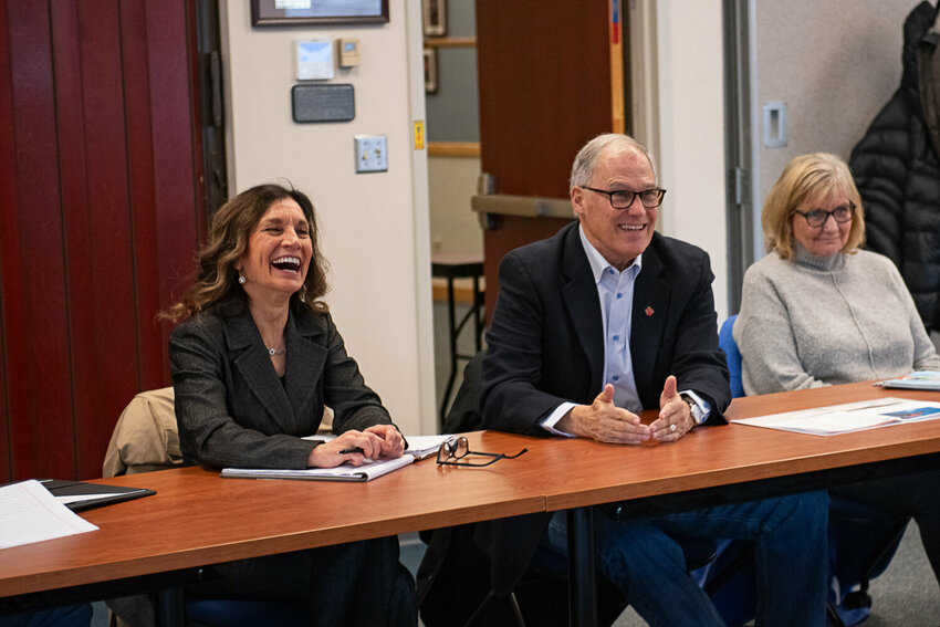 Gov. Jay Inslee, centers, explains the longterm benefits of a push for green energy, during a roundtable at Centralia College on Friday, Jan. 19. To the right of Inslee is his wife, Trudi, and to his left is Lisa Grant, the superintendent of the Centralia School District.