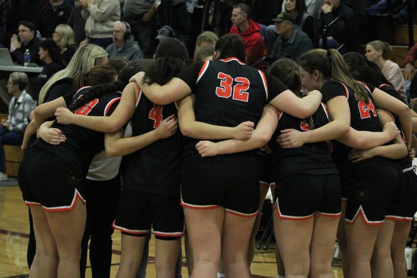 The Rainier Mountaineers huddle before tipoff against Napavine in the 2B District 4 title game on Feb. 17.