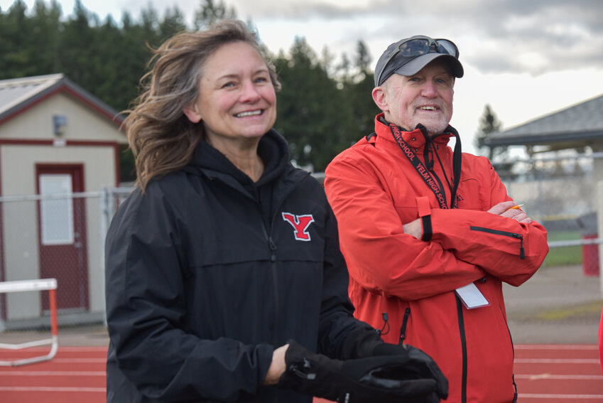 Yelm High School&rsquo;s head track and field coaches Shannon Gubser, girls, and Richard Houghton, boys, smile after practice on Monday, Feb. 26.