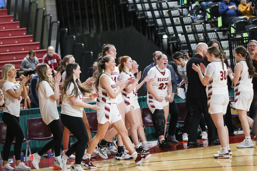 W.F. West players celebrate after defeating West Valley Spokane 61-40 in Wednesday's Class 2A Round of 12 contest in Yakima.