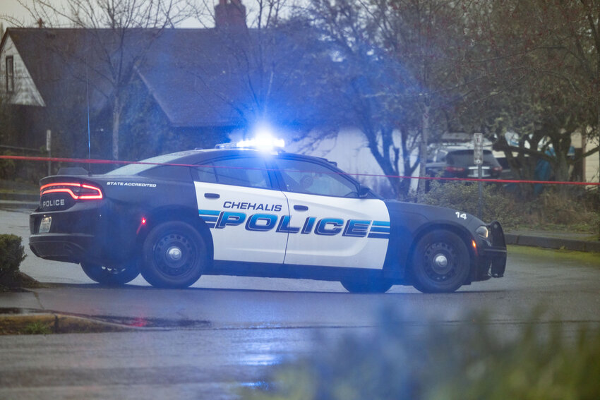 A police car blocks off the back parking lot in Chehalis outside of Chase Bank on Wednesday, Feb. 28.