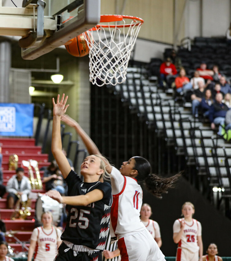 W.F. West's Grace Simpson (25) converts a layup against Prosser during Thursday's Class 2A qauterfinal contest in Yakima.