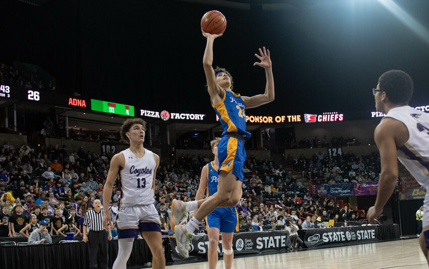 Jens Neilson flys to the hoop during Adna&rsquo;s 2B quarterfinal loss against Columbia (Burbank) on Feb. 29 in Spokane Arena.