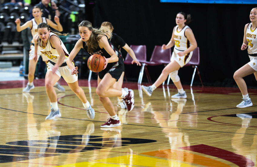 W.F. West's Joy Cushman runs the fastbreak against White River during Friday's Class 2A elimination game in Yakima.