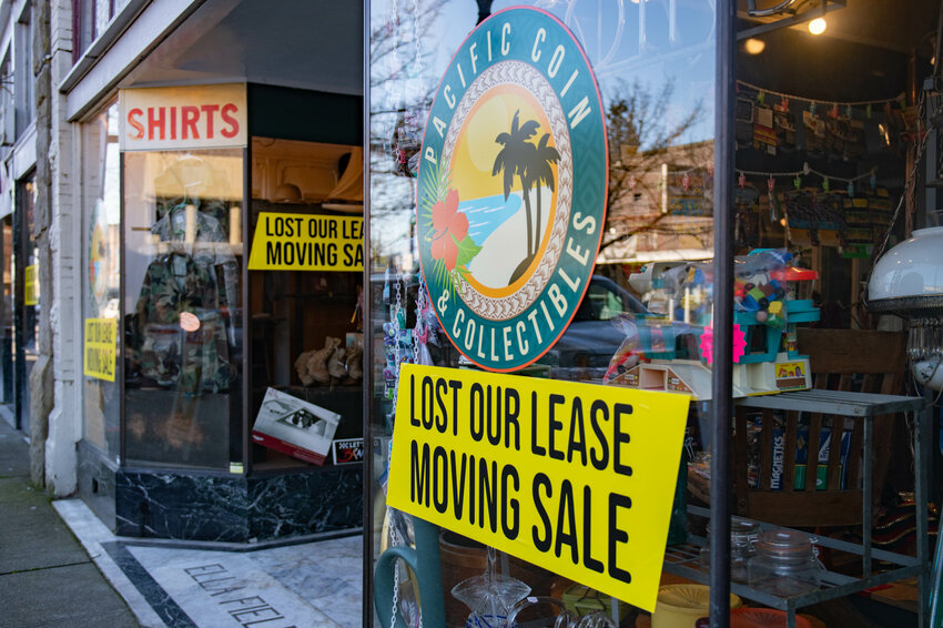 Moving sale signs are displayed outside of Pacific Coin &amp; Collectibles and Alivia's Attic in downtown Centralia on Feb. 23.