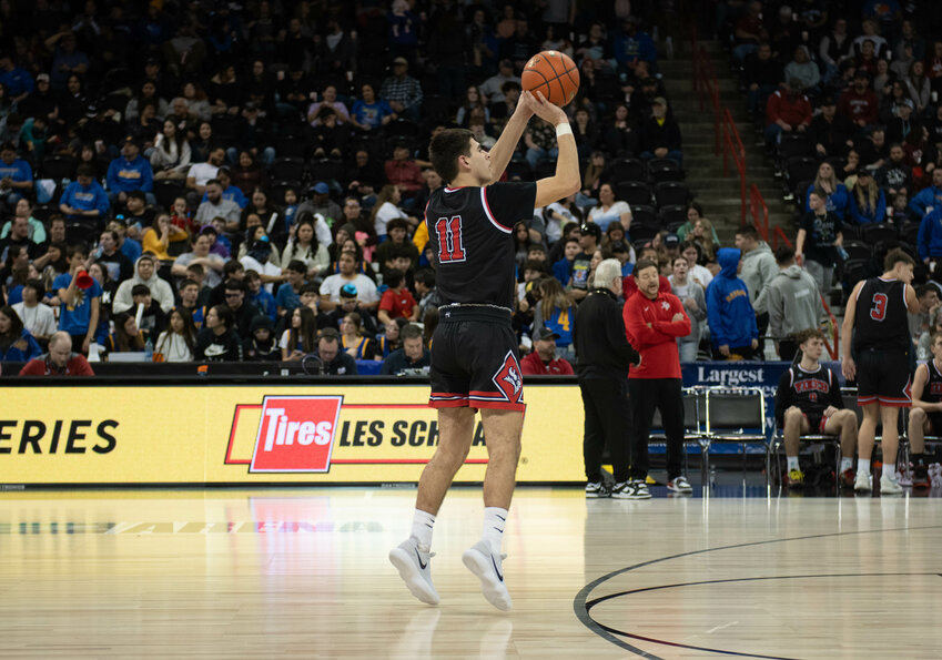 Zack Munoz shoots a 3-pointer during Mossyrock's 1B state championship game versus Wellpinit on March 2 at the Spokane Arena.