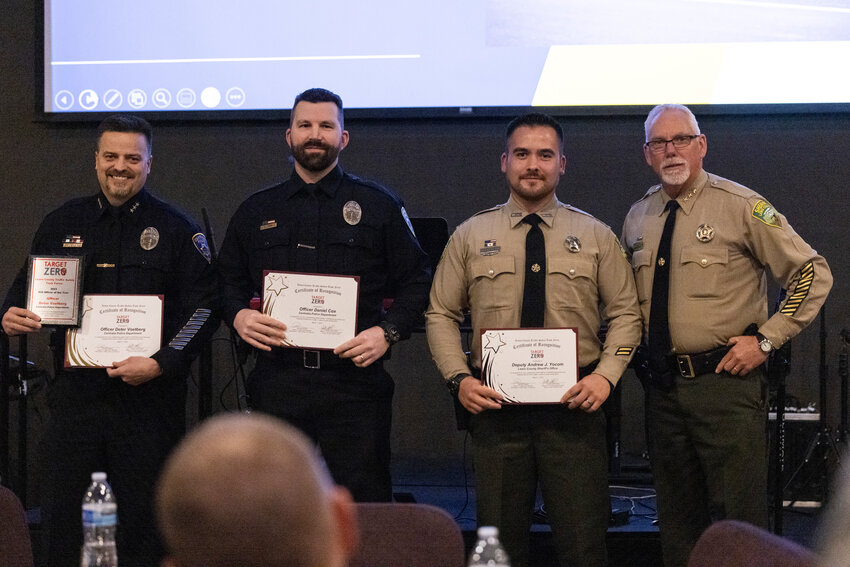 DUI Enforcement award nominees for mid-size agencies stand pose for a picture during the Target Zero awards at Bethel Church on Friday, March 1. Officer Deter Voetberg received the award.