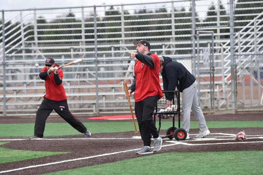 Head coach Dakota Hill instructs his athetes during some fielding practice on Monday, March 4.