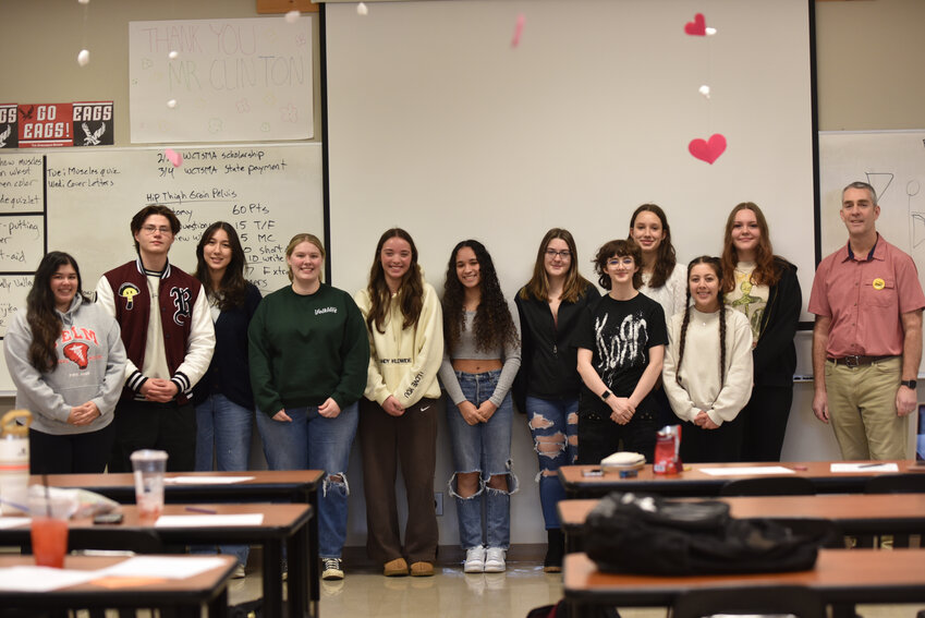 Yelm High School sports medicine students and teachers smile for a photo on Thursday, Feb. 29 in class.
